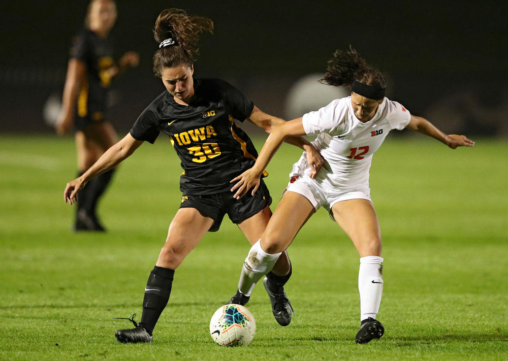 Iowa forward Devin Burns (30) battles for position on the ball during the second half of their match against Illinois at the Iowa Soccer Complex in Iowa City on Thursday, Sep 26, 2019. (Stephen Mally/hawkeyesports.com)