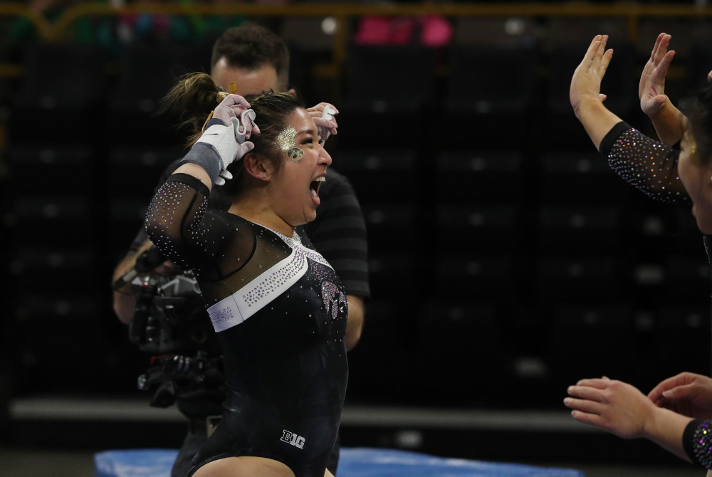 Iowa's Nicole Chowl competes on the bars against the Rutgers Scarlet Knights Saturday, January 26, 2019 at Carver-Hawkeye Arena. (Brian Ray/hawkeyesports.com)