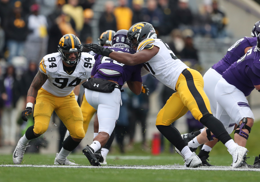 Iowa Hawkeyes defensive lineman Cedrick Lattimore (95) and defensive end A.J. Epenesa (94) against the Northwestern Wildcats Saturday, October 26, 2019 at Ryan Field in Evanston, Ill. (Brian Ray/hawkeyesports.com)