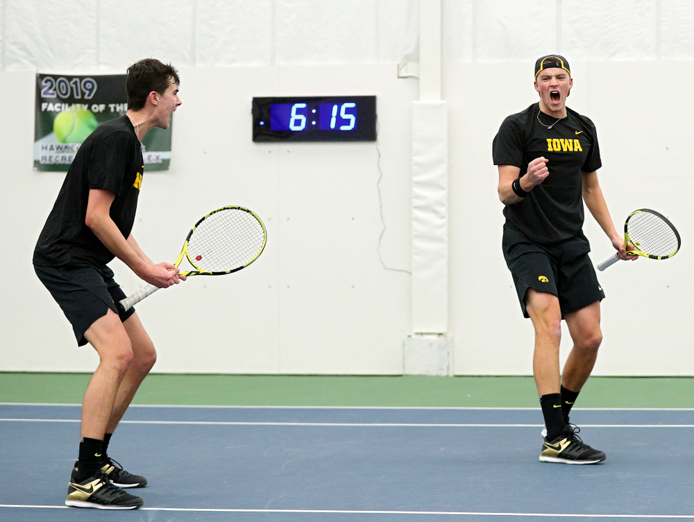 Iowa’s Matt Clegg (from left) and Joe Tyler celebrate a point during their doubles match at the Hawkeye Tennis and Recreation Complex in Iowa City on Friday, February 14, 2020. (Stephen Mally/hawkeyesports.com)