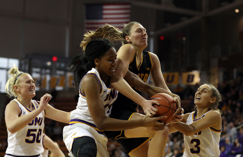 Iowa Hawkeyes forward Amanda Ollinger (43) battles for a rebound against Northern IowaÕs Bre Gunnels (11) Sunday, November 17, 2019 at the McLeod Center. (Brian Ray/hawkeyesports.com)