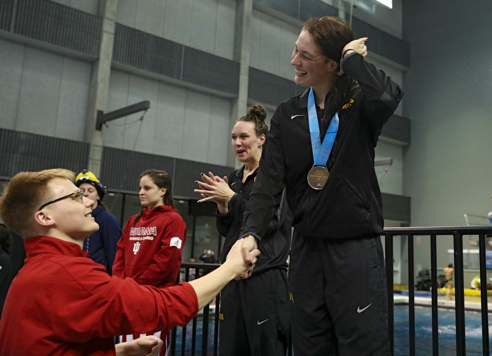 Iowa’s Hannah Burvill on the awards stand after placing third in the women’s 200 yard freestyle final event during the 2020 Women’s Big Ten Swimming and Diving Championships at the Campus Recreation and Wellness Center in Iowa City on Friday, February 21, 2020. (Stephen Mally/hawkeyesports.com)