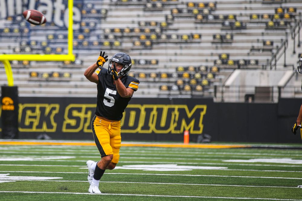 Iowa's Oliver Martin catches a pass during the Kids Day at Kinnick Stadium on Saturday, August 10, 2019 (Lily Smith/hawkeyesports.com)