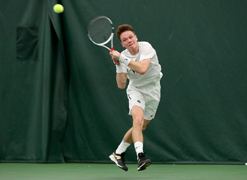 Iowa’s Jason Kerst returns a shot during his singles match at the Hawkeye Tennis and Recreation Complex in Iowa City on Sunday, February 16, 2020. (Stephen Mally/hawkeyesports.com)