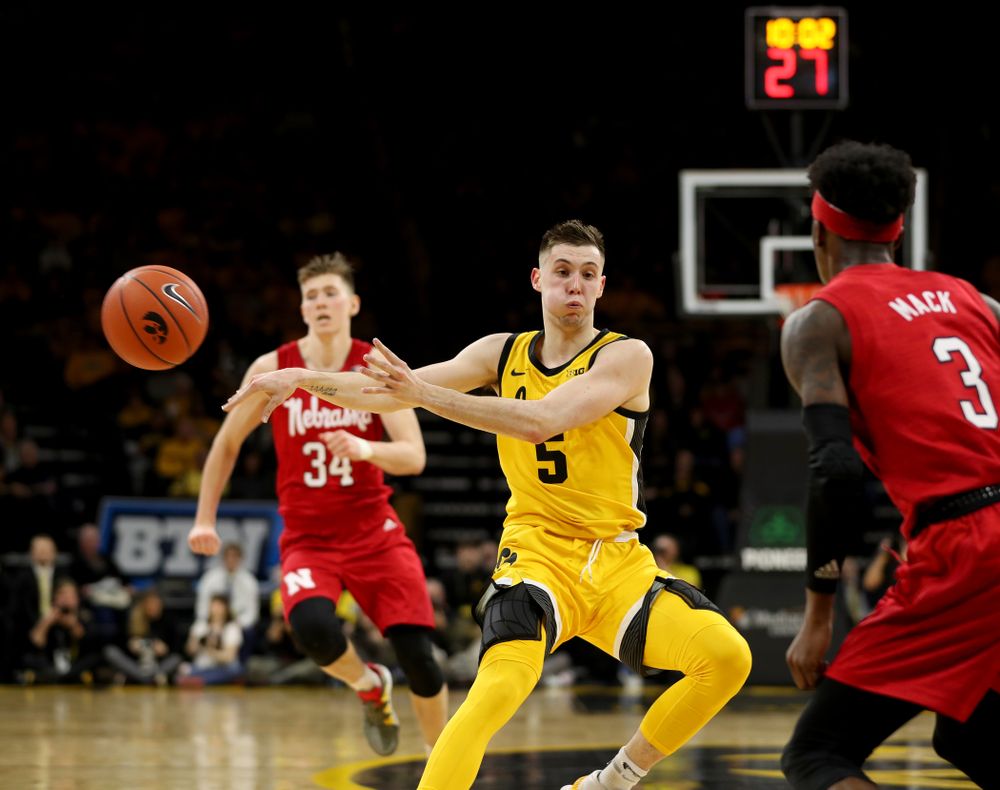 Iowa Hawkeyes guard CJ Fredrick (5) dishes off a pass against the Nebraska Cornhuskers Saturday, February 8, 2020 at Carver-Hawkeye Arena. (Brian Ray/hawkeyesports.com)