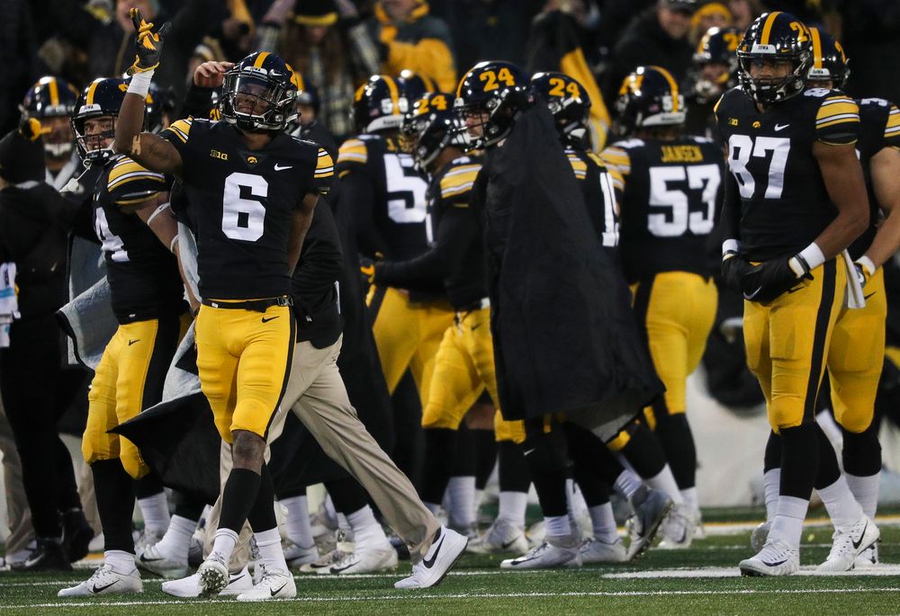 Iowa Hawkeyes wide receiver Ihmir Smith-Marsette (6) signals for a first down after a replay review reversed the call on the field during a game against Northwestern at Kinnick Stadium on November 10, 2018. (Tork Mason/hawkeyesports.com)