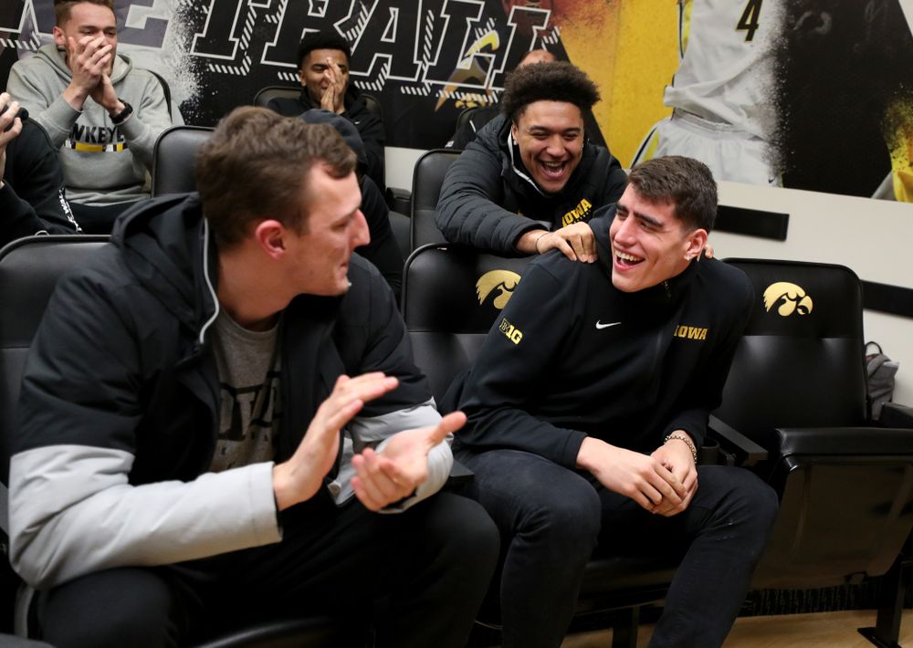 The Iowa Hawkeyes congratulate forward Luka Garza (55) after finding out that he has been named the Big Ten Player of the Year Monday, March 9, 2020 at Carver-Hawkeye Arena. (Brian Ray/hawkeyesports.com)