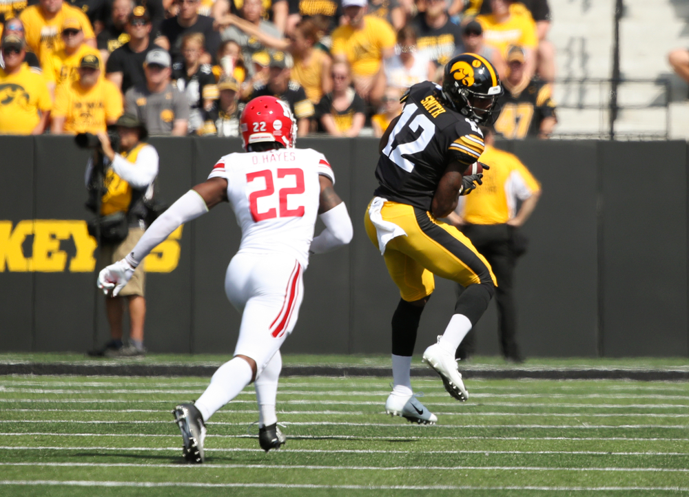 Iowa Hawkeyes wide receiver Brandon Smith (12) pulls in a pass during the first quarter of their Big Ten Conference football game at Kinnick Stadium in Iowa City on Saturday, Sep 7, 2019. (Stephen Mally/hawkeyesports.com)