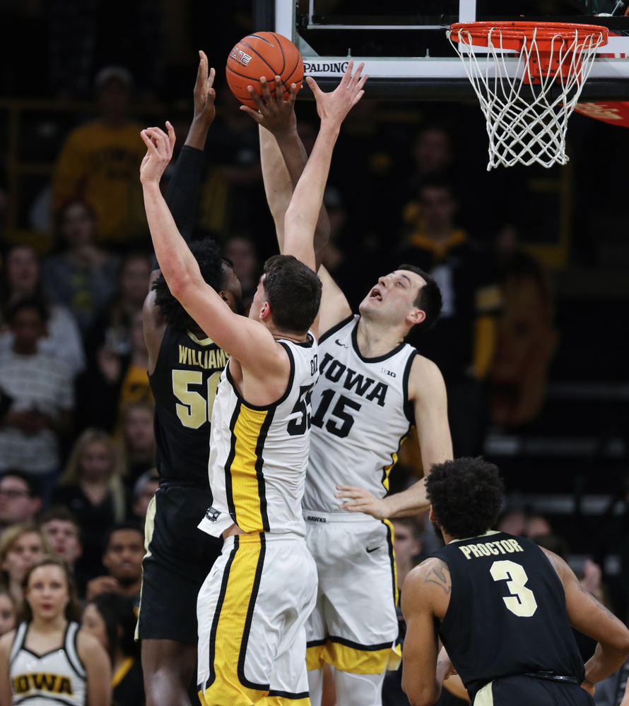Iowa Hawkeyes forward Ryan Kriener (15) blocks a shot against the Purdue Boilermakers Tuesday, March 3, 2020 at Carver-Hawkeye Arena. (Brian Ray/hawkeyesports.com)