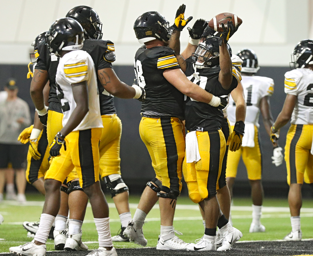 Iowa Hawkeyes running back Mekhi Sargent (10) celebrates with offensive lineman Landan Paulsen (68) in the end zone during Fall Camp Practice No. 6 at the Hansen Football Performance Center in Iowa City on Thursday, Aug 8, 2019. (Stephen Mally/hawkeyesports.com)