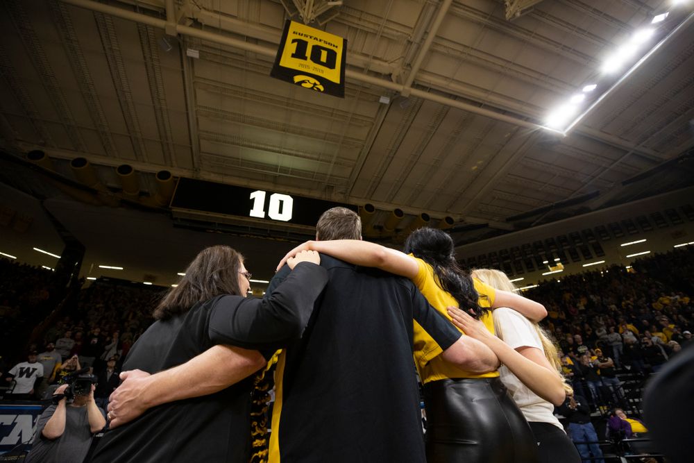 Megan Gustafson stands with her family as her number is raised into the rafters during a jersey retirement ceremony Sunday, January 26, 2020 at Carver-Hawkeye Arena. (Brian Ray/hawkeyesports.com)
