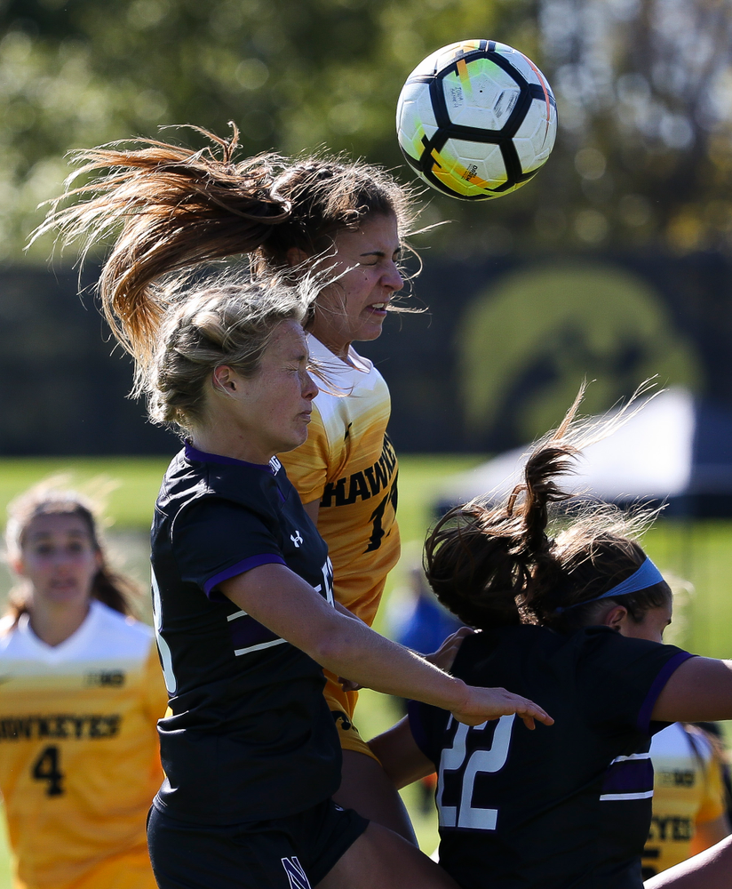 Iowa Hawkeyes defender Hannah Drkulec (17) heads the ball during a game against Northwestern at the Iowa Soccer Complex on October 21, 2018. (Tork Mason/hawkeyesports.com)