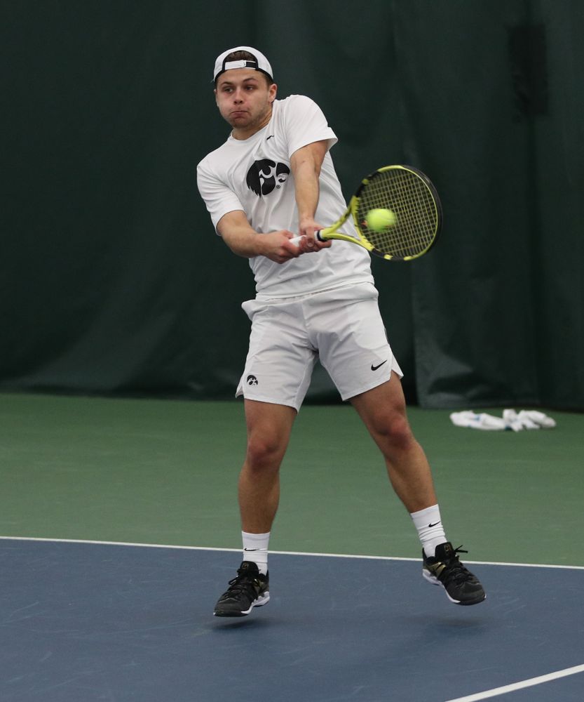 Iowa’s Will Davies against Cornell Sunday, March 8, 2020 at the Hawkeye Tennis and Recreation Center. (Brian Ray/hawkeyesports.com)