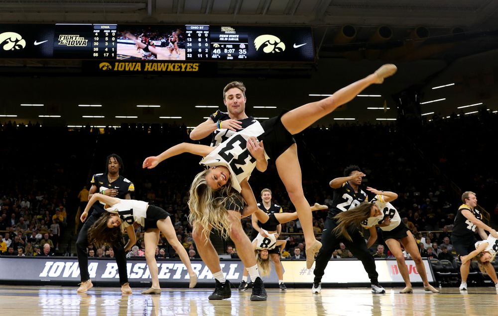 Members of the Hawkeye Football team performs with the Iowa Dance Team at halftime of the Iowa Hawkeyes game against the Ohio State Buckeyes Thursday, February 20, 2020 at Carver-Hawkeye Arena. (Brian Ray/hawkeyesports.com)