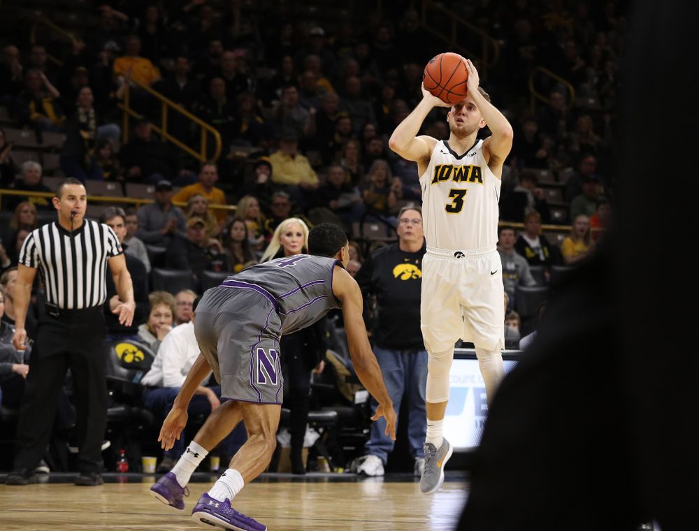 Iowa Hawkeyes guard Jordan Bohannon (3) makes a three point basket against the Northwestern Wildcats Sunday, February 10, 2019 at Carver-Hawkeye Arena. (Brian Ray/hawkeyesports.com)