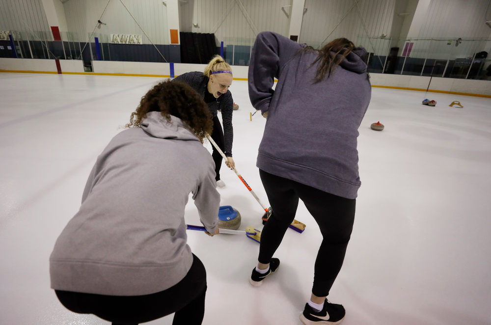 Members of the Iowa Softball team learn the sport of curling as part of a team building event Wednesday, January 10, 2018 at the Cedar Rapids Ice Arena. (Brian Ray/hawkeyesports.com)