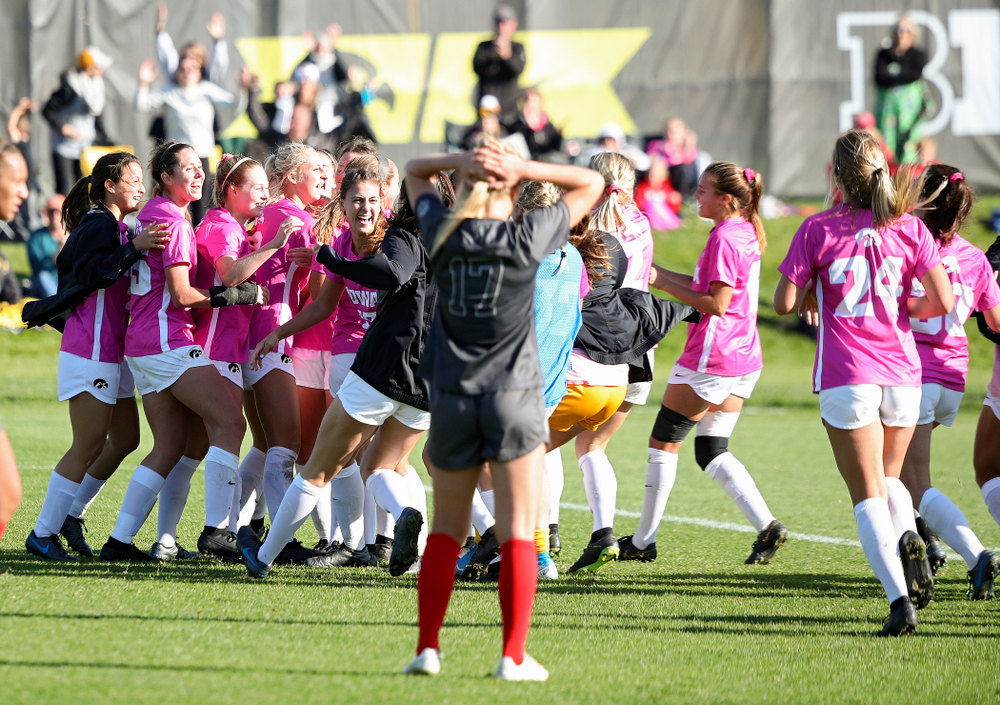 Iowa forward Samantha Tawharu (27) celebrates with her teammates after scoring the game winning golden goal during the second overtime of their match at the Iowa Soccer Complex in Iowa City on Sunday, Oct 27, 2019. (Stephen Mally/hawkeyesports.com)