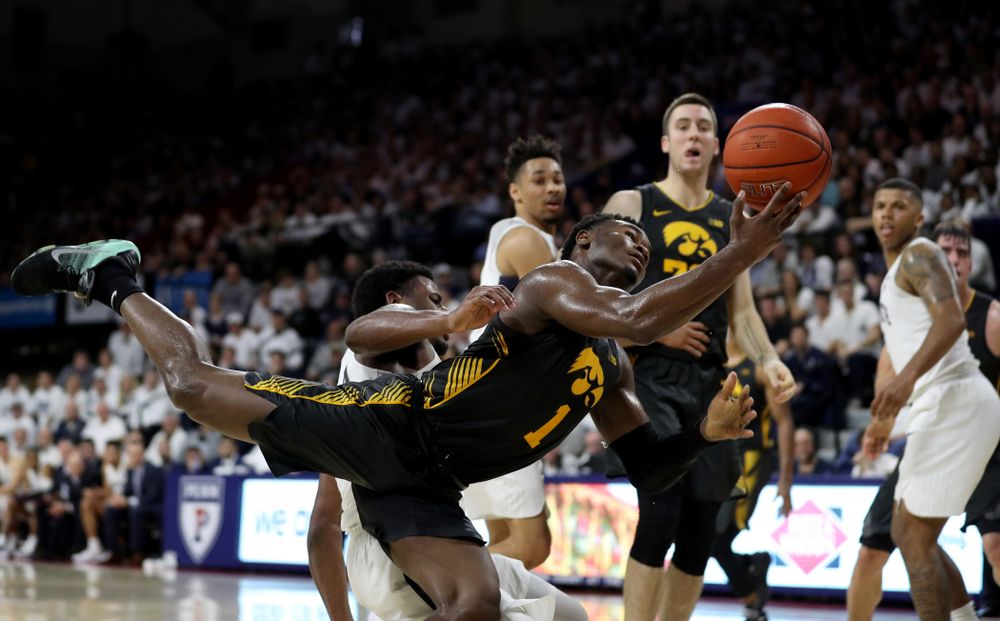 Iowa Hawkeyes guard Joe Toussaint (1) draws a foul against Penn State Saturday, January 4, 2020 at the Palestra in Philadelphia. (Brian Ray/hawkeyesports.com)