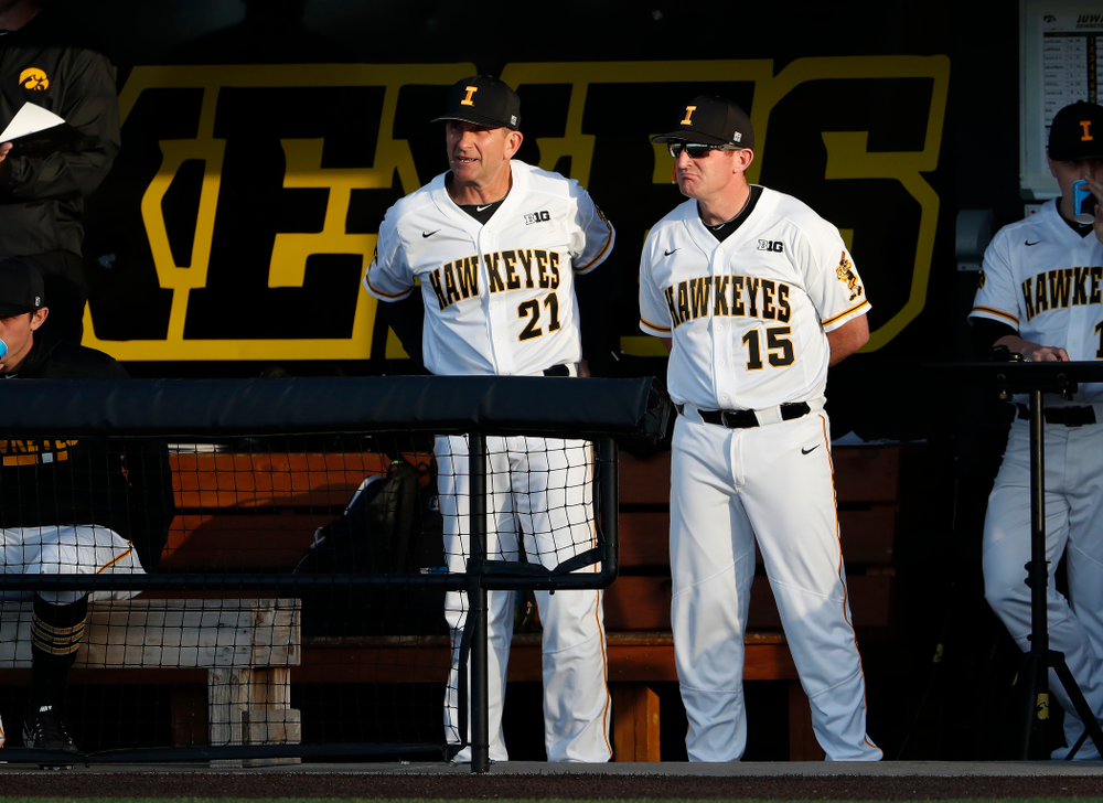 Iowa Hawkeyes head coach Rick Heller and associate head coach Marty Sutherland against the Michigan Wolverines Friday, April 27, 2018 at Duane Banks Field in Iowa City. (Brian Ray/hawkeyesports.com)