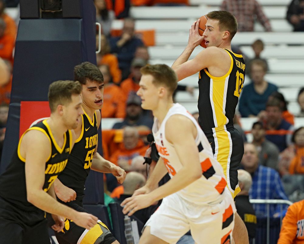 Iowa Hawkeyes guard Joe Wieskamp (10) pulls down a rebound during the first half of their ACC/Big Ten Challenge game at the Carrier Dome in Syracuse, N.Y. on Tuesday, Dec 3, 2019. (Stephen Mally/hawkeyesports.com)