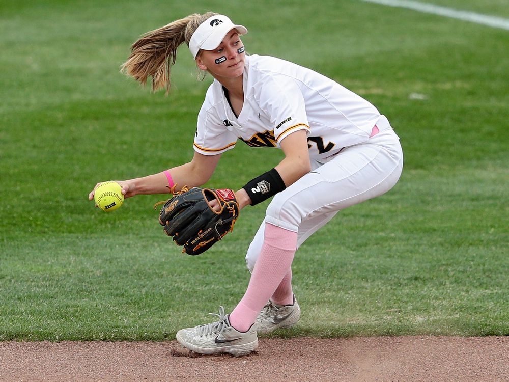 Iowa second baseman Aralee Bogar (2) fields a ball before throwing to first base for an out during the first inning of their game against Iowa State at Pearl Field in Iowa City on Tuesday, Apr. 9, 2019. (Stephen Mally/hawkeyesports.com)