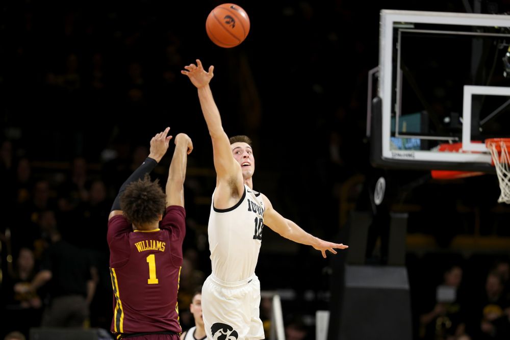 Iowa Hawkeyes guard Joe Wieskamp (10) blocks a shot against the Minnesota Golden Gophers Monday, December 9, 2019 at Carver-Hawkeye Arena. (Brian Ray/hawkeyesports.com)