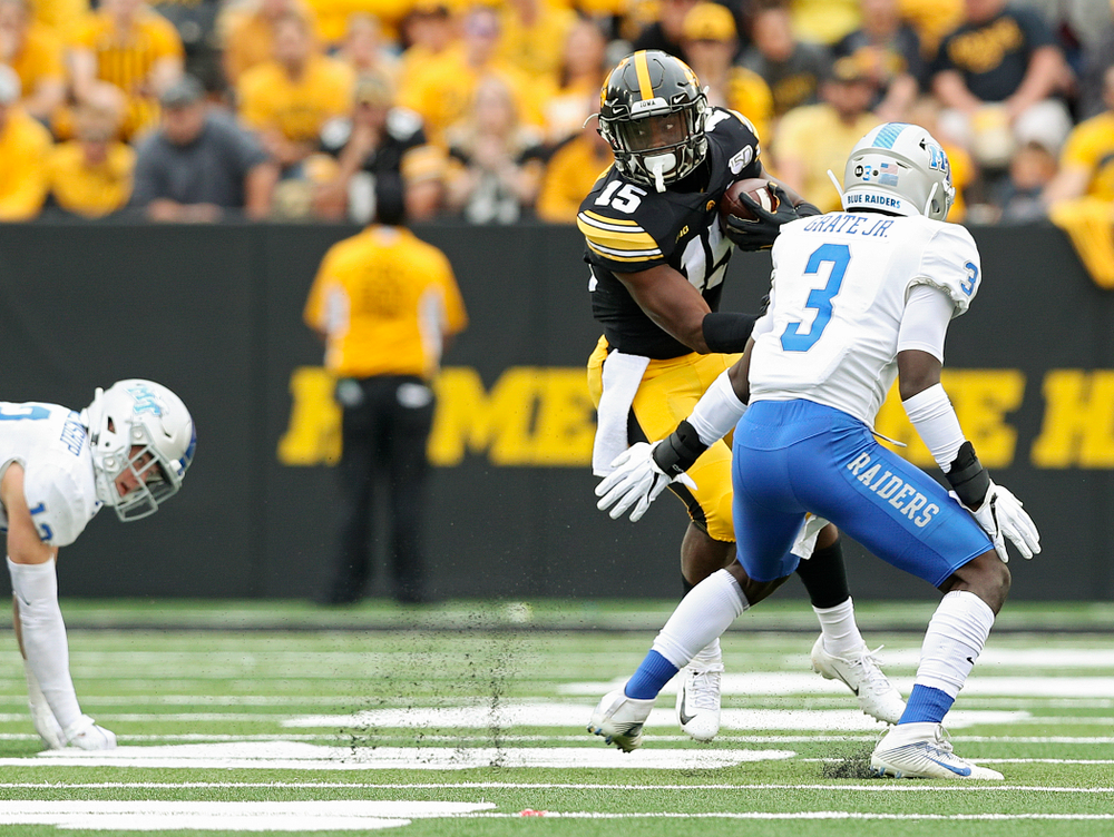 Iowa Hawkeyes running back Tyler Goodson (15) jukes a defender during fourth quarter of their game at Kinnick Stadium in Iowa City on Saturday, Sep 28, 2019. (Stephen Mally/hawkeyesports.com)