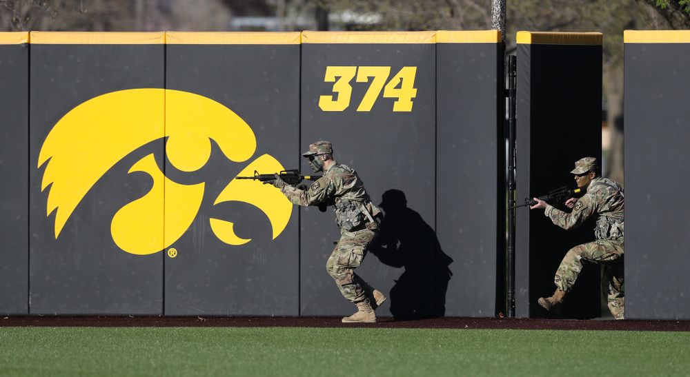 Members of the University of Iowa ROTC deliver the game ball before the Iowa Hawkeyes game against the Nebraska Cornhuskers on Military Appreciation Night Friday, April 19, 2019 at Duane Banks Field. (Brian Ray/hawkeyesports.com)