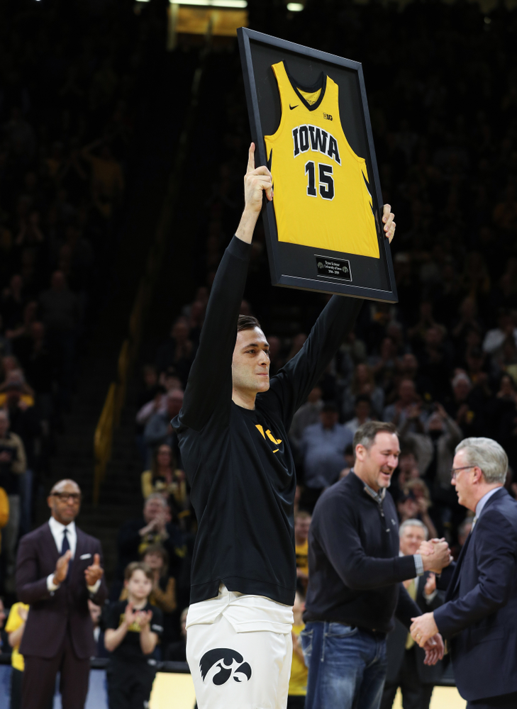 Iowa Hawkeyes forward Ryan Kriener (15) hold up his jersey during senior night activities before their game against the Purdue Boilermakers Tuesday, March 3, 2020 at Carver-Hawkeye Arena. (Brian Ray/hawkeyesports.com)