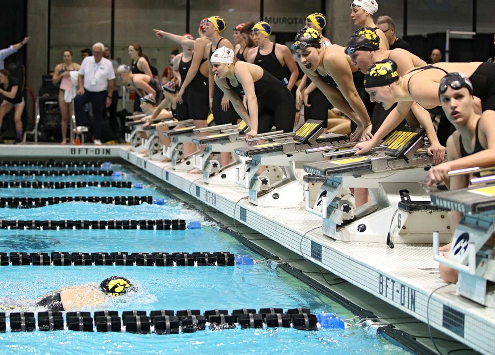 Iowa’s Macy Rink is urged on by teammates Hannah Burvill, Allyssa Fluit, and Emilia Sansome as she swims the 800 yard freestyle relay event during the 2020 Big Ten Women’s Swimming and Diving Championships at the Campus Recreation and Wellness Center in Iowa City on Wednesday, February 19, 2020. (Stephen Mally/hawkeyesports.com)