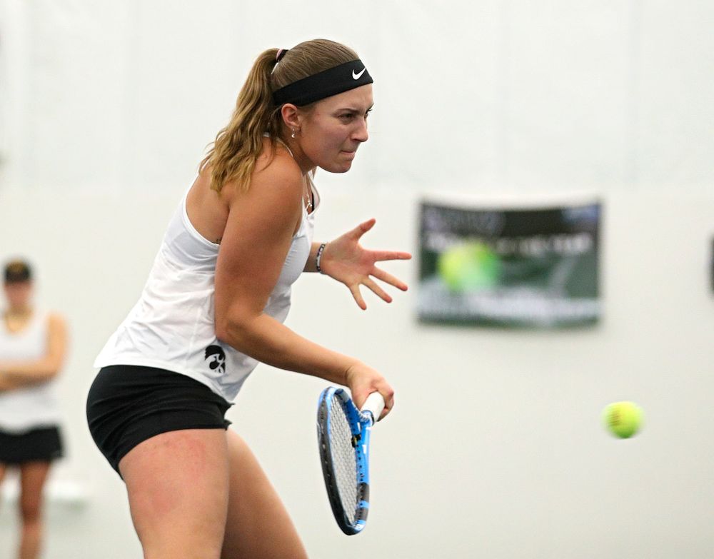 Iowa’s Ashleigh Jacobs returns a shot during her doubles match at the Hawkeye Tennis and Recreation Complex in Iowa City on Sunday, February 23, 2020. (Stephen Mally/hawkeyesports.com)