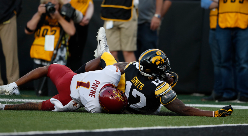 Iowa Hawkeyes wide receiver Brandon Smith (12) picks up a first down against the Iowa State Cyclones Saturday, September 8, 2018 at Kinnick Stadium. (Brian Ray/hawkeyesports.com)