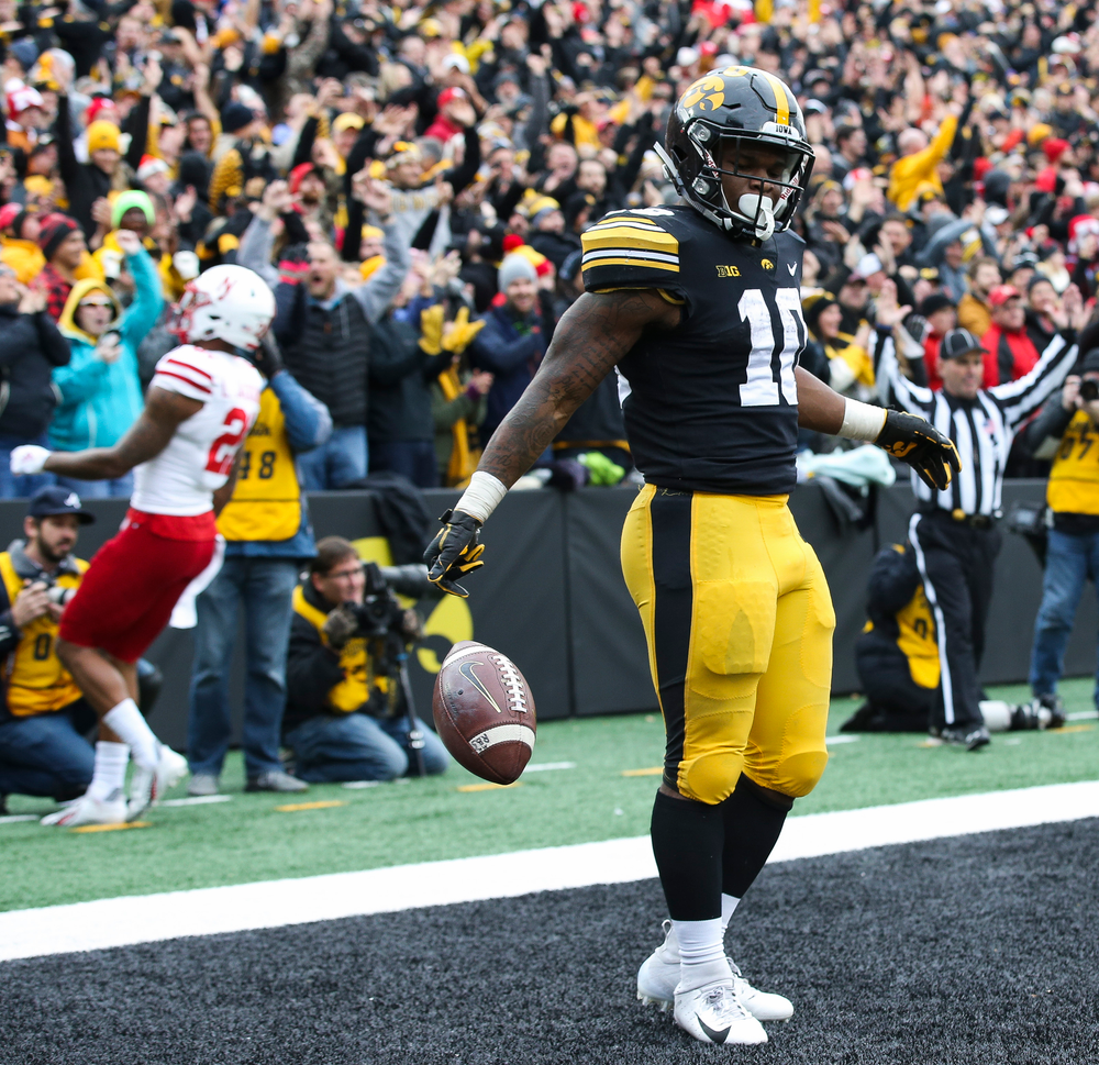 Iowa Hawkeyes running back Mekhi Sargent (10) celebrates after scoring a touchdown during a game against Nebraska at Kinnick Stadium on November 23, 2018. (Tork Mason/hawkeyesports.com)