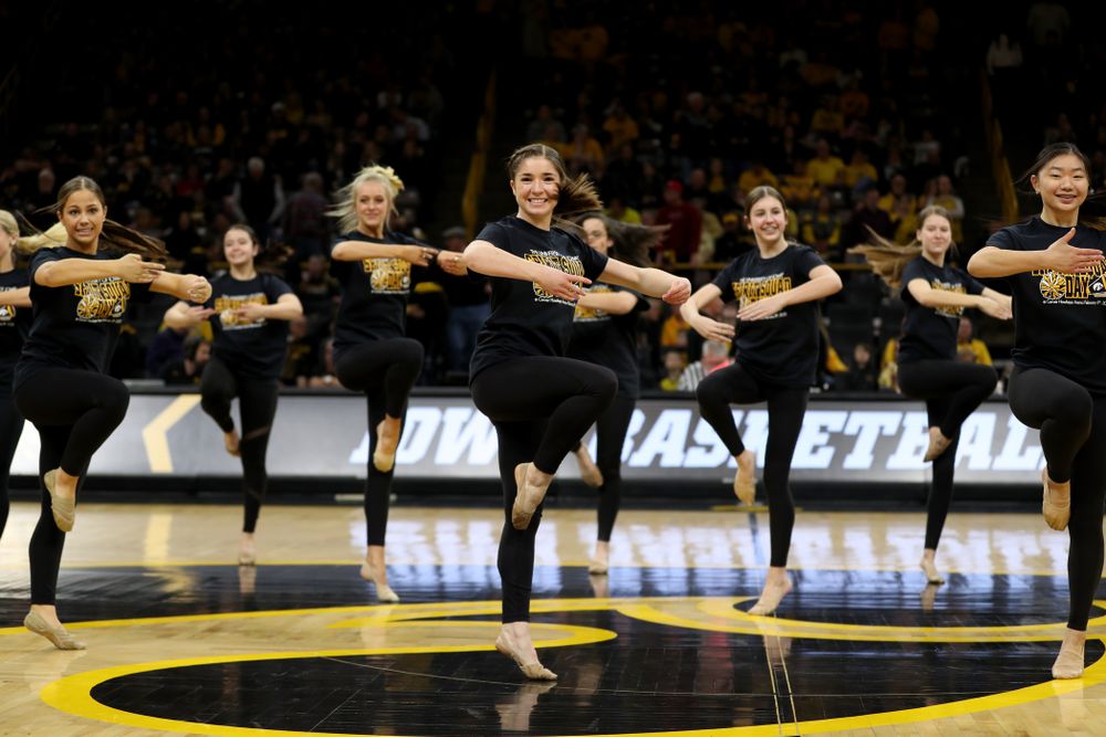 The Iowa Spirit Squad performs with participants in Spirit Squad Day at halftime of the Iowa Hawkeyes game against the Nebraska Cornhuskers Saturday, February 8, 2020 at Carver-Hawkeye Arena. (Brian Ray/hawkeyesports.com)