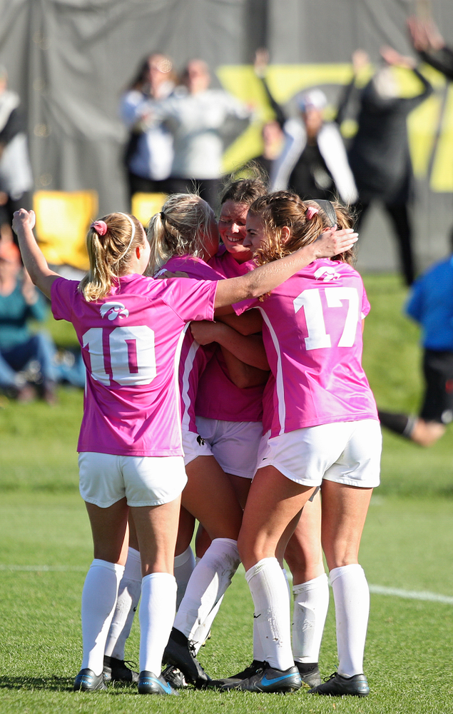Iowa forward Samantha Tawharu (27) celebrates with her teammates after scoring the game winning golden goal during the second overtime of their match at the Iowa Soccer Complex in Iowa City on Sunday, Oct 27, 2019. (Stephen Mally/hawkeyesports.com)