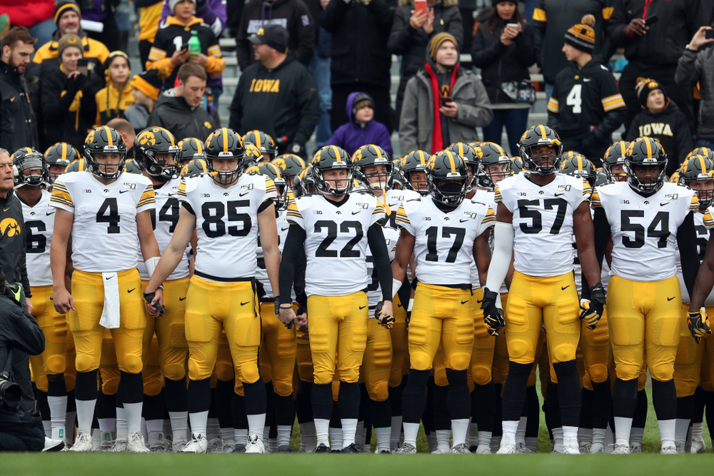 The Iowa Hawkeyes swarm the field against the Northwestern Wildcats Saturday, October 26, 2019 at Ryan Field in Evanston, Ill. (Brian Ray/hawkeyesports.com)