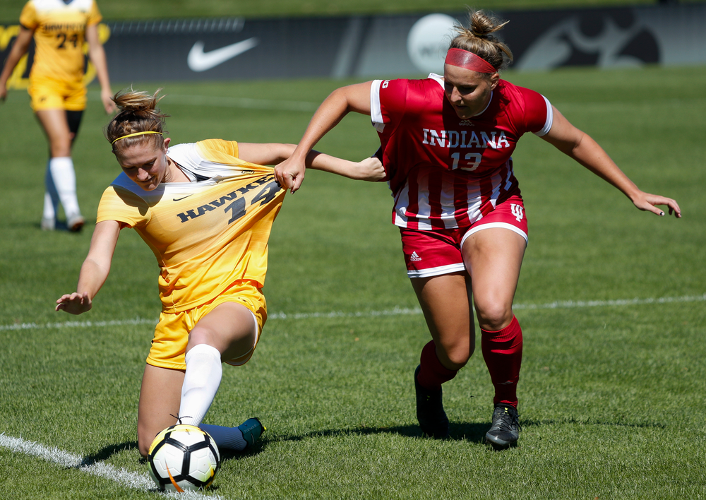 Iowa Hawkeyes defender Leah Moss (14) battles for possession during a game against Indiana at the Iowa Soccer Complex on September 23, 2018. (Tork Mason/hawkeyesports.com)