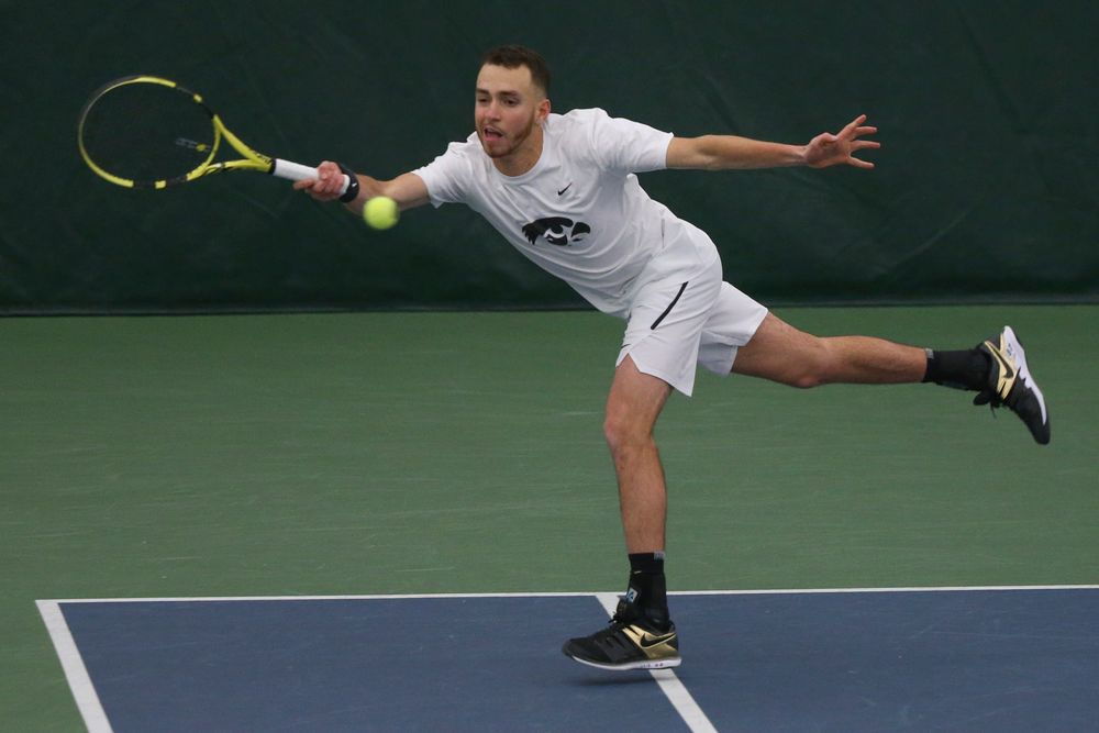 Iowa’s Kareem Allaf returns a hit during the Iowa men’s tennis meet vs Nebraska on Sunday, March 1, 2020 at the Hawkeye Tennis and Recreation Complex. (Lily Smith/hawkeyesports.com)