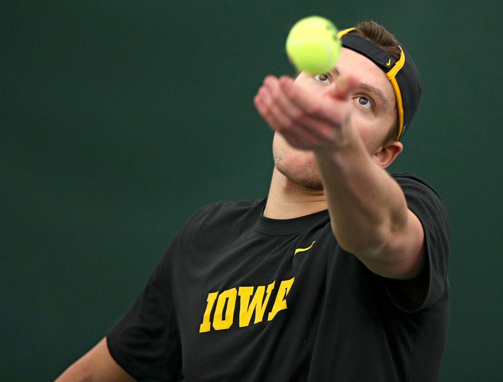 Iowa’s Joe Tyler serves during their match at the Hawkeye Tennis and Recreation Complex in Iowa City on Thursday, January 16, 2020. (Stephen Mally/hawkeyesports.com)