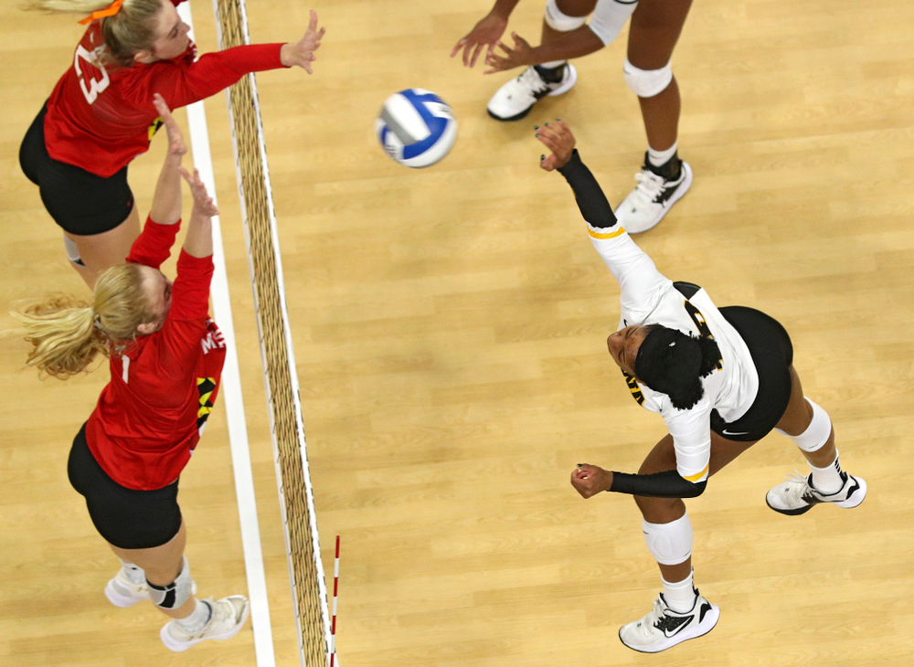 Iowa’s Griere Hughes (10) sends a kill over during the second set of their match at Carver-Hawkeye Arena in Iowa City on Saturday, Nov 30, 2019. (Stephen Mally/hawkeyesports.com)