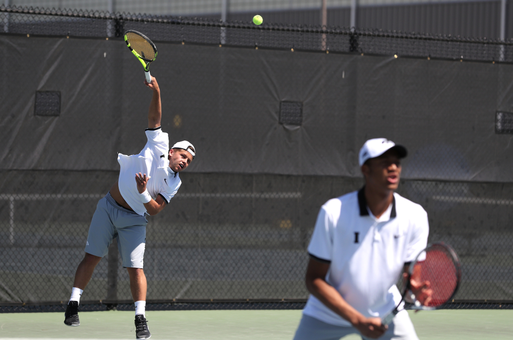 IowaÕs Oliver Okonkwo and Will Davies play a doubles match against the Michigan Wolverines Sunday, April 21, 2019 at the Hawkeye Tennis and Recreation Complex. (Brian Ray/hawkeyesports.com)
