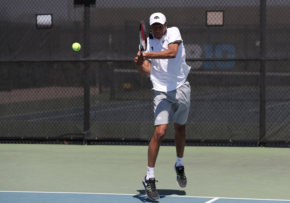 IowaÕs Oliver Okonkwo and Will Davies play a doubles match against the Michigan Wolverines Sunday, April 21, 2019 at the Hawkeye Tennis and Recreation Complex. (Brian Ray/hawkeyesports.com)