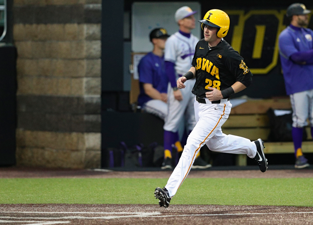 Iowa Hawkeyes left fielder Chris Whelan (28) scores a run during the fourth inning of their game against Western Illinois at Duane Banks Field in Iowa City on Wednesday, May. 1, 2019. (Stephen Mally/hawkeyesports.com)