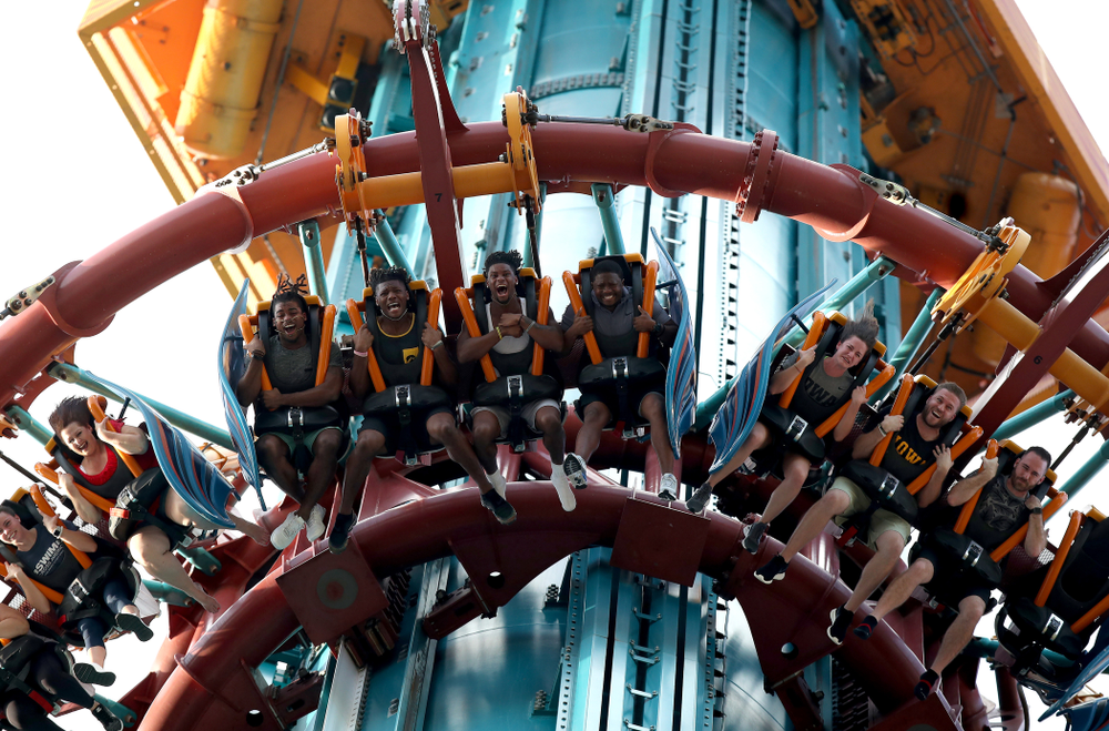 Iowa Hawkeyes defensive back Devonte Young (17), wide receiver Brandon Smith (12), wide receiver Ihmir Smith-Marsette (6), and and running backs coach Derrick Foster ride Falcon's Fury during an Outback Bowl team event Saturday, December 29, 2018 at Busch Gardens in Tampa, FL. (Brian Ray/hawkeyesports.com)