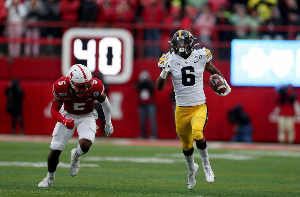 Iowa Hawkeyes wide receiver Ihmir Smith-Marsette (6) returns a kickoff for a touchdown against the Nebraska Cornhuskers Friday, November 29, 2019 at Memorial Stadium in Lincoln, Neb. (Brian Ray/hawkeyesports.com)