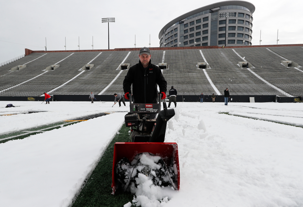 Members of the Iowa Athletics Turf Management staff create the #SnowWave for kids in the Stead Family Children's Hospital Thursday, February