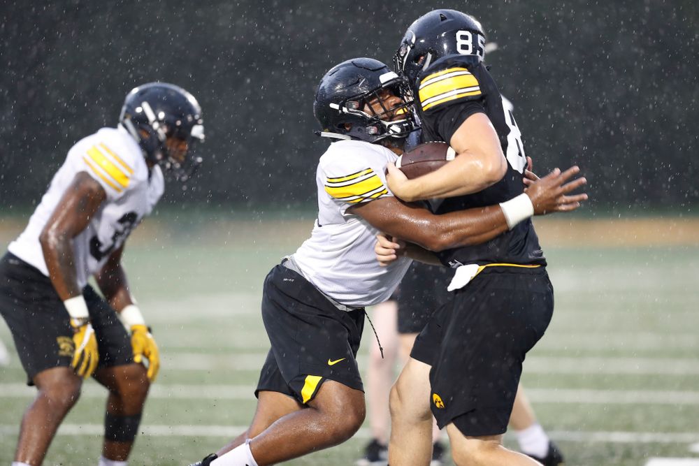 Iowa Hawkeyes linebacker Djimon Colbert (32) and tight end Nate Vejvoda (85) during camp practice No. 15 Monday, August 20, 2018 at the Hansen Football Performance Center. (Brian Ray/hawkeyesports.com)