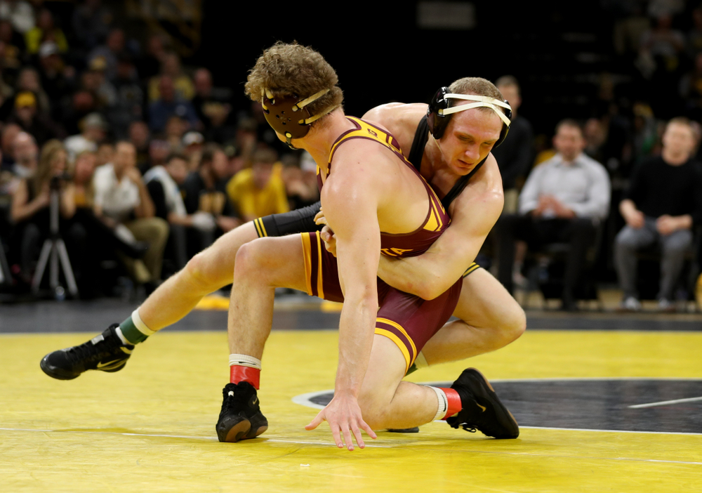 Iowa’s Kaleb Young wrestles Minnesota’s Ryan Thomas at 157 pounds Saturday, February 15, 2020 at Carver-Hawkeye Arena. Young won the match 5-4 in extra time. (Brian Ray/hawkeyesports.com)