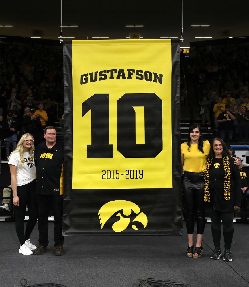 Megan Gustafson stands with her family as her number is raised into the rafters during a jersey retirement ceremony Sunday, January 26, 2020 at Carver-Hawkeye Arena. (Brian Ray/hawkeyesports.com)