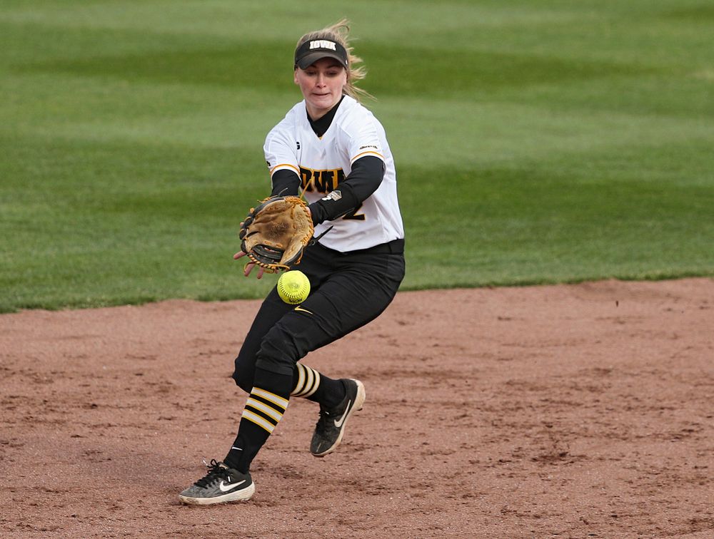 Iowa second baseman Aralee Bogar (2) fields a ground ball before stepping on second base for an out during the fourth inning of their game against Illinois at Pearl Field in Iowa City on Friday, Apr. 12, 2019. (Stephen Mally/hawkeyesports.com)